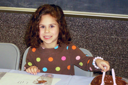 Little Girl Playing with Chocolate